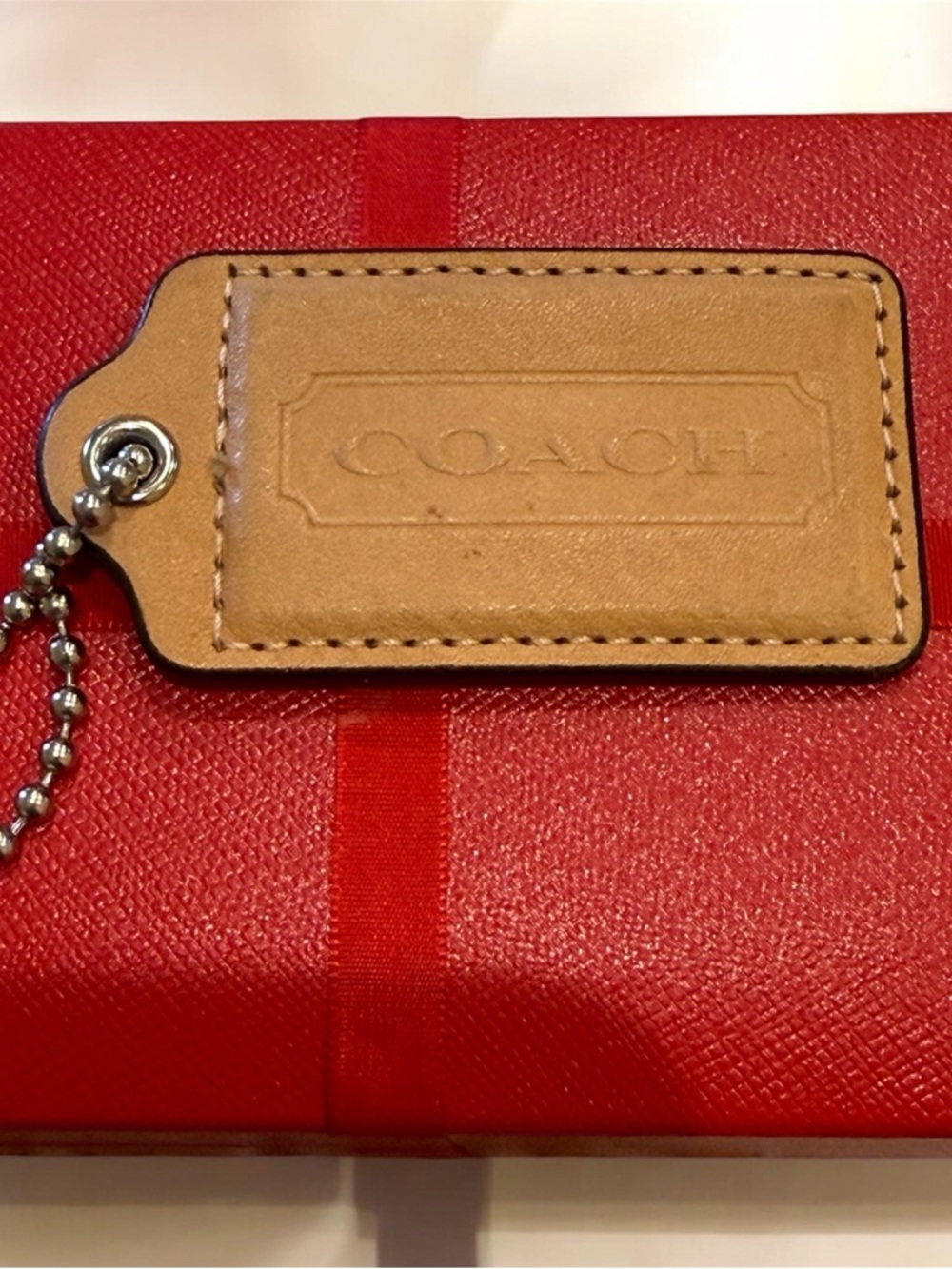 Coach tan hang tag large size
